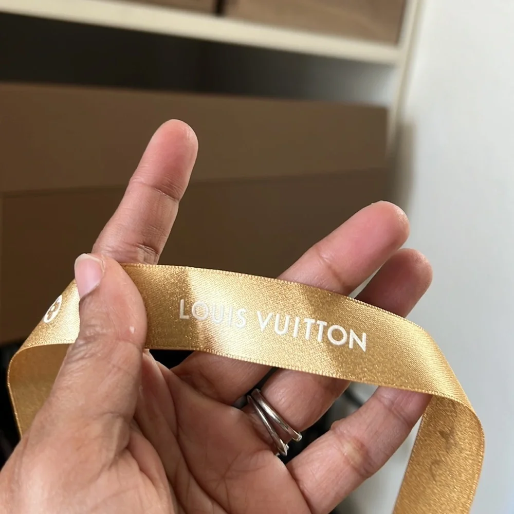 Louis Vuitton gold ribbon